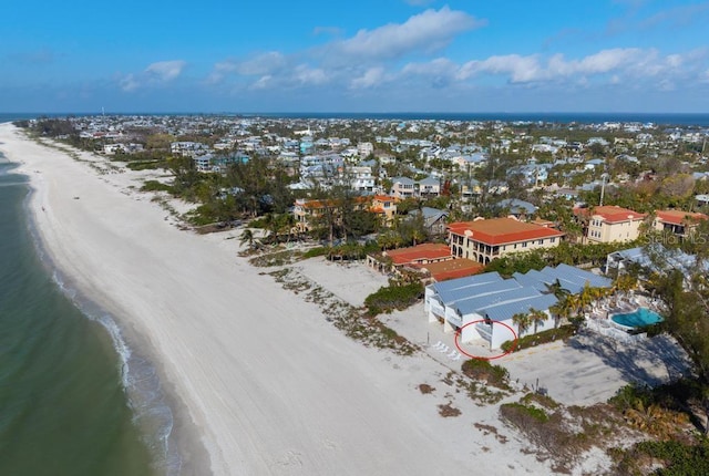 aerial view featuring a water view and a view of the beach