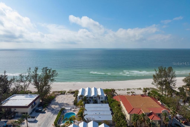 bird's eye view featuring a water view and a view of the beach