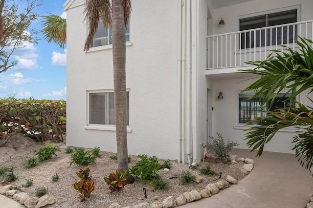 view of home's exterior with a balcony