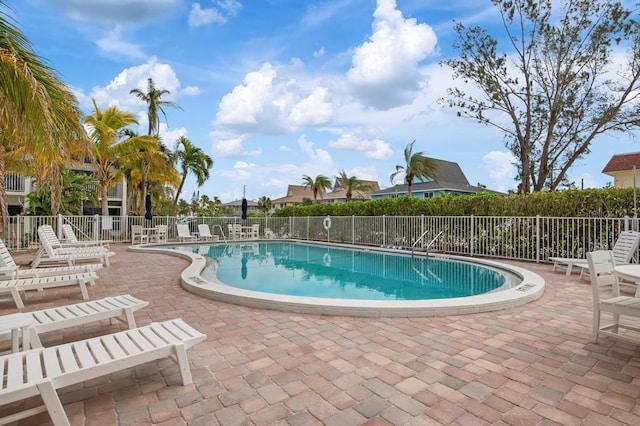 view of swimming pool featuring a patio area