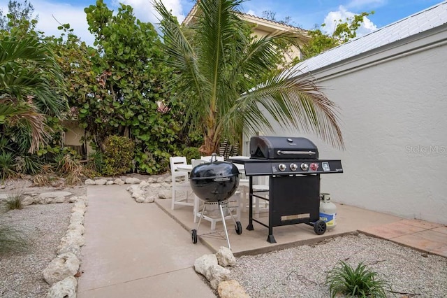 view of patio featuring a grill