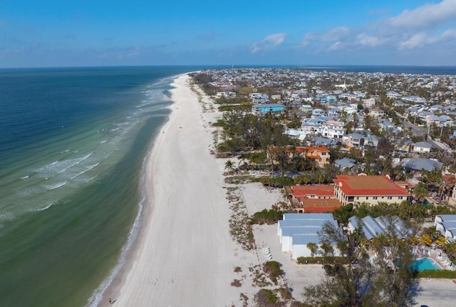 birds eye view of property featuring a view of the beach and a water view