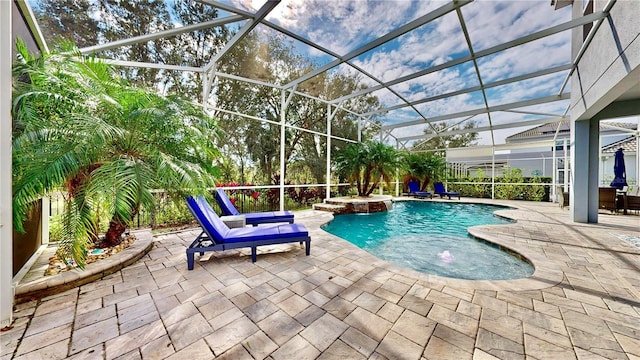 view of swimming pool with a lanai, an in ground hot tub, and a patio