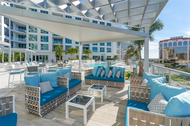 view of patio / terrace featuring a city view and an outdoor living space