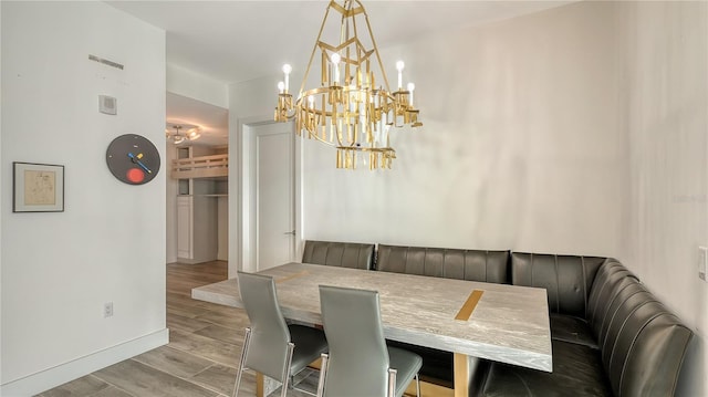 dining room with light wood finished floors and baseboards