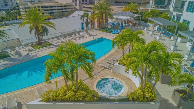 pool with a gazebo, a patio, fence, and a pergola