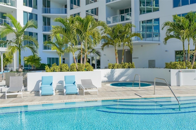 pool featuring a hot tub