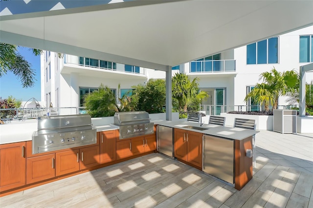 view of patio featuring area for grilling and a grill