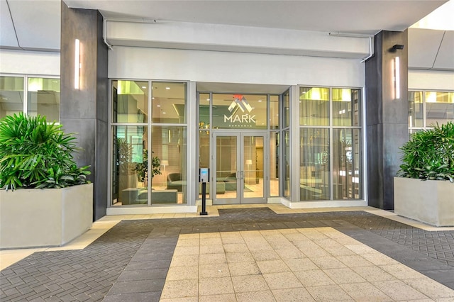 entrance to property featuring stucco siding