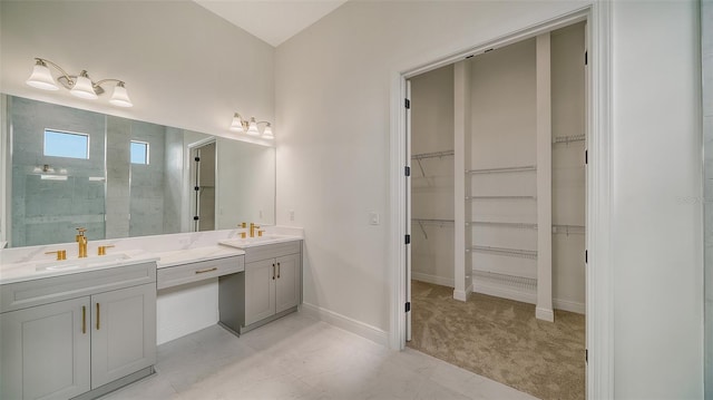 bathroom with a shower and vanity