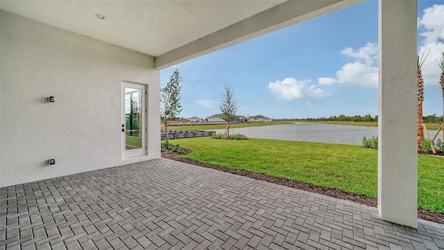 view of patio / terrace featuring a water view