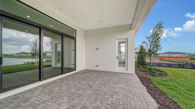 view of patio / terrace featuring a water view