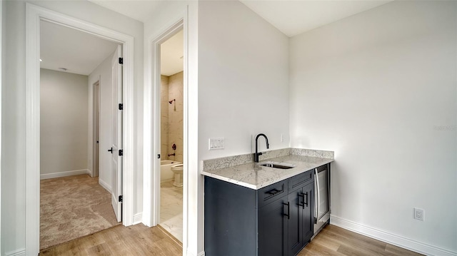 interior space with vanity and hardwood / wood-style floors