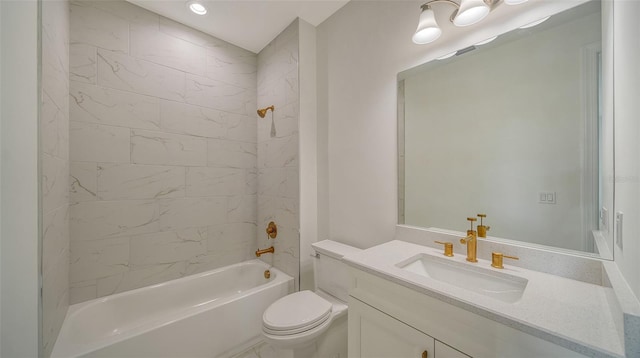 full bathroom featuring toilet, tiled shower / bath combo, and vanity