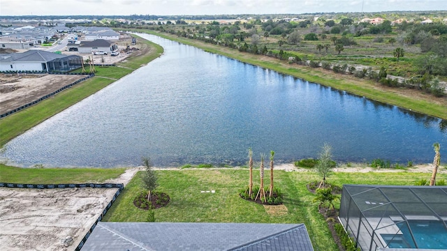 birds eye view of property featuring a water view