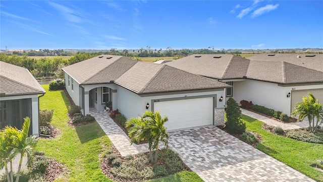 single story home featuring a front yard and a garage