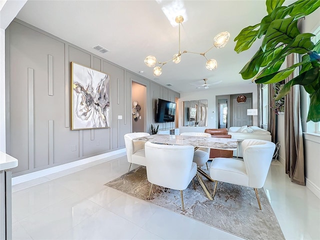 dining room featuring ceiling fan and a healthy amount of sunlight