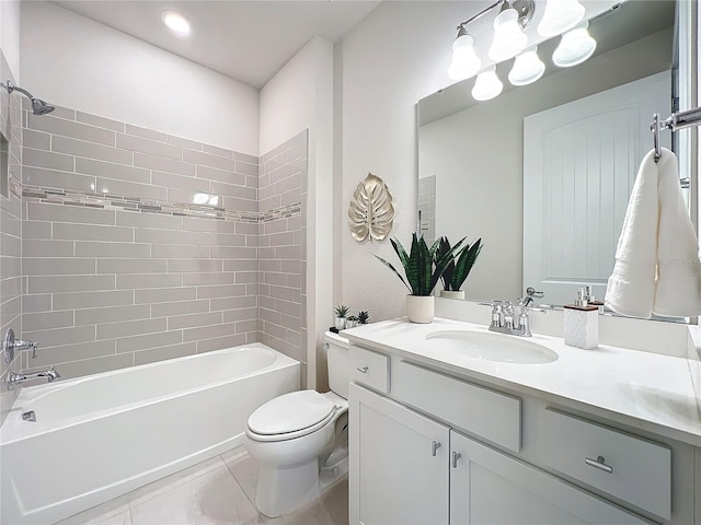 full bathroom featuring tile patterned flooring, vanity, tiled shower / bath combo, and toilet