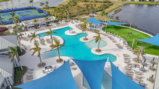 view of swimming pool featuring a water view