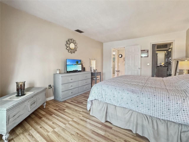 bedroom with light hardwood / wood-style floors