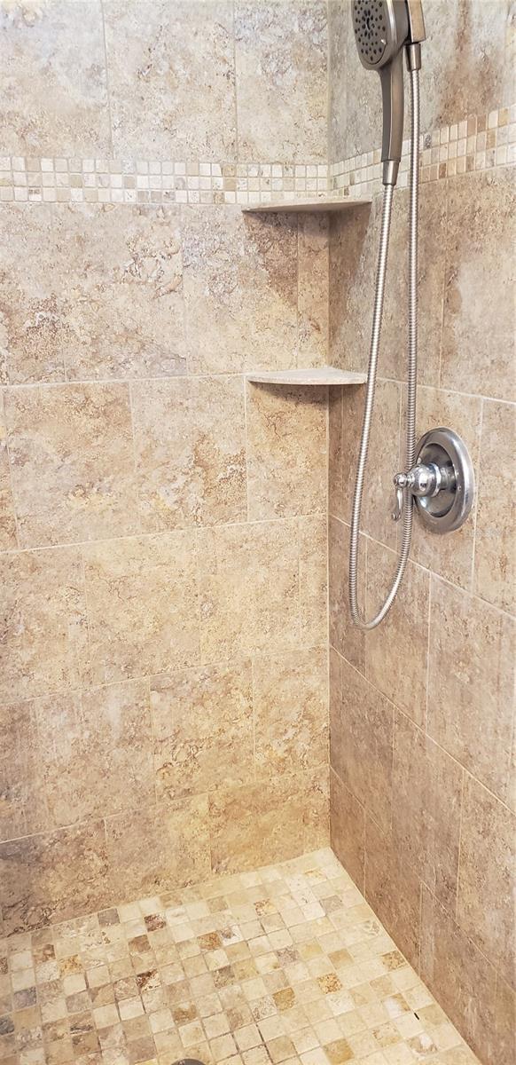 room details with a tile shower