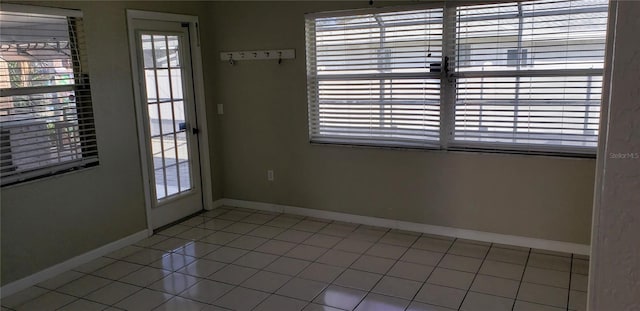 doorway to outside featuring tile patterned floors