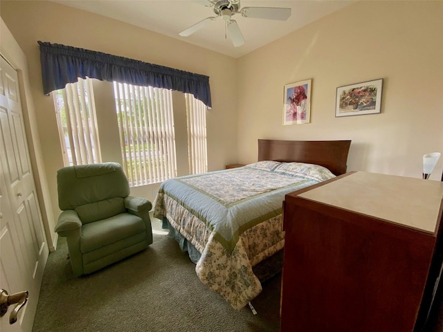 carpeted bedroom featuring a closet and ceiling fan