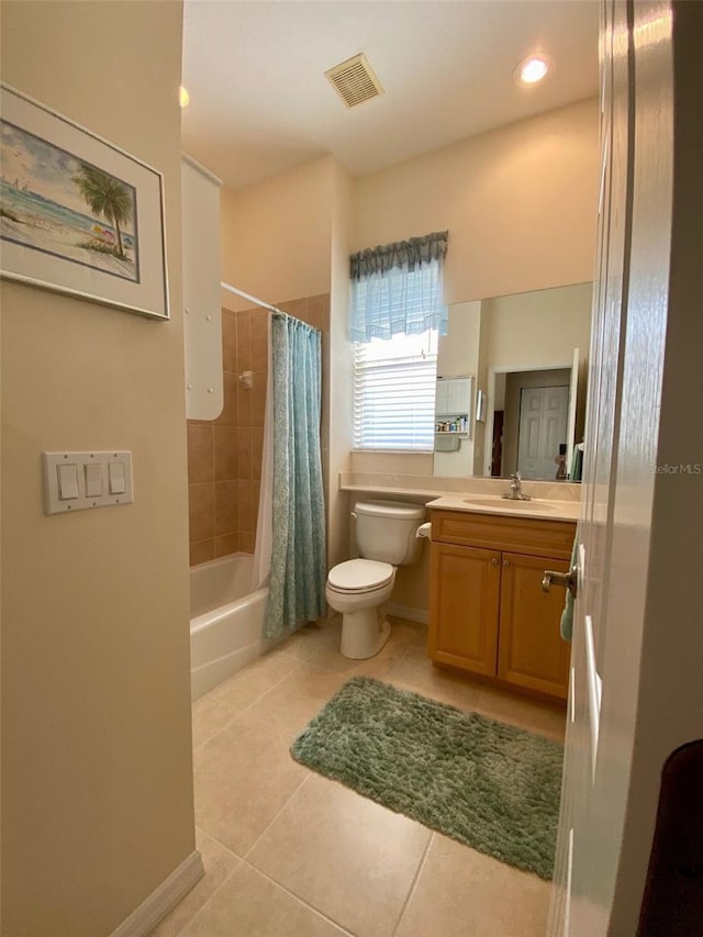 full bathroom featuring tile patterned flooring, shower / bath combination with curtain, vanity, and toilet