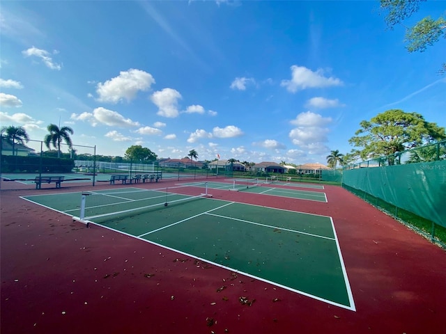 view of tennis court featuring basketball court