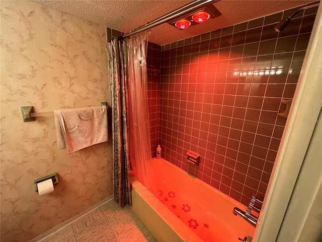 bathroom featuring shower / bath combo with shower curtain and a textured ceiling