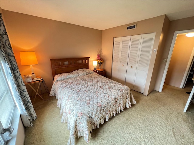 bedroom with carpet floors and a closet