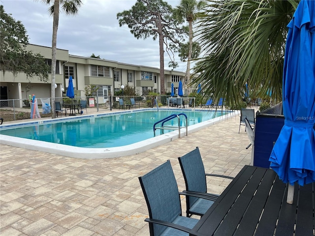 view of swimming pool with a patio area