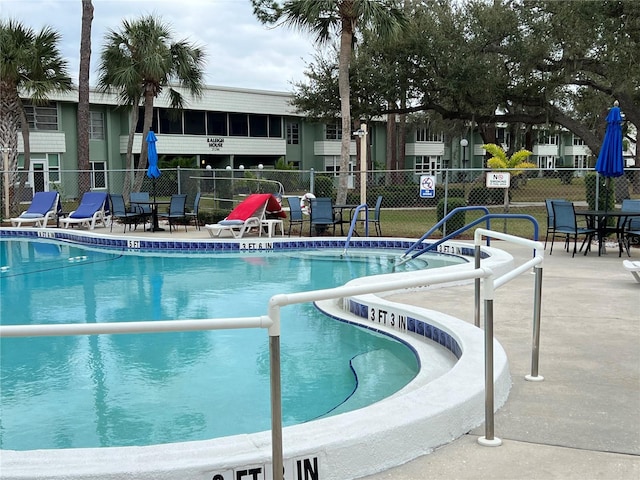 view of swimming pool featuring a patio