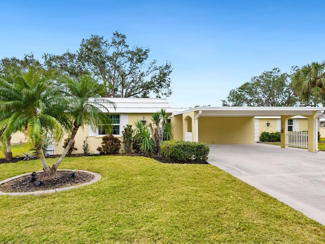 ranch-style house with a front lawn and a carport