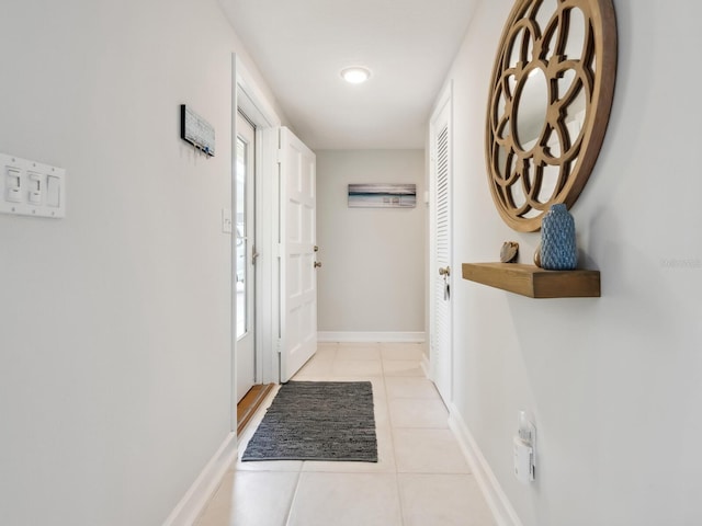 hallway featuring light tile patterned floors