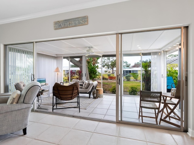 sunroom featuring ceiling fan