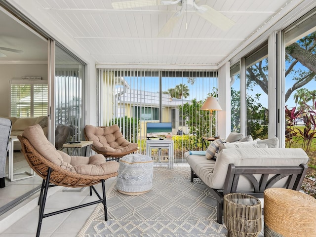 sunroom / solarium featuring ceiling fan