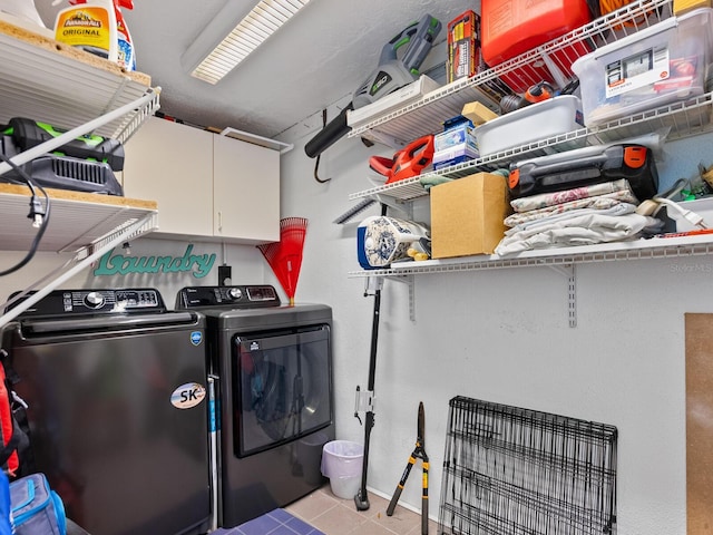 laundry area with cabinets and independent washer and dryer