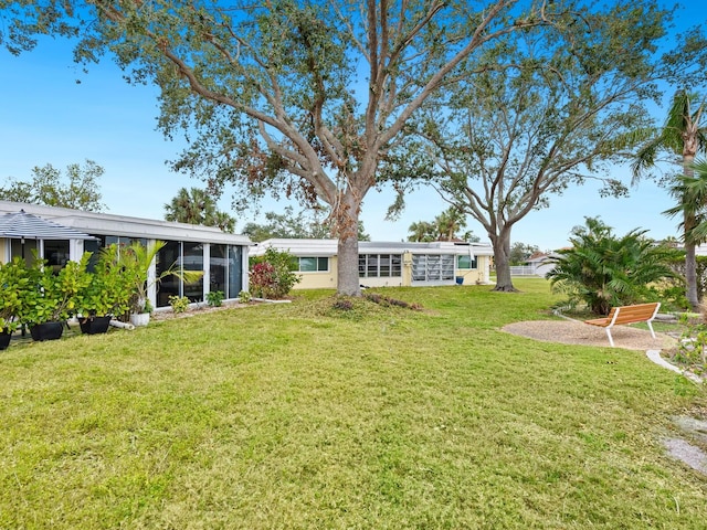 view of yard featuring a sunroom