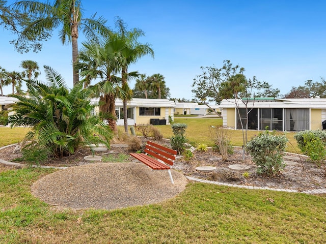 view of yard with a sunroom