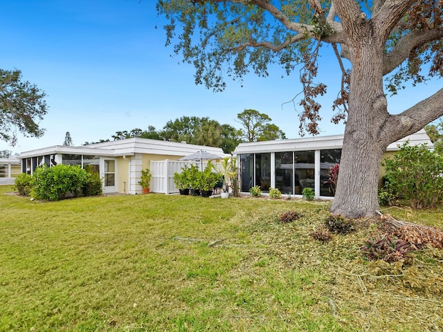 view of yard with a sunroom