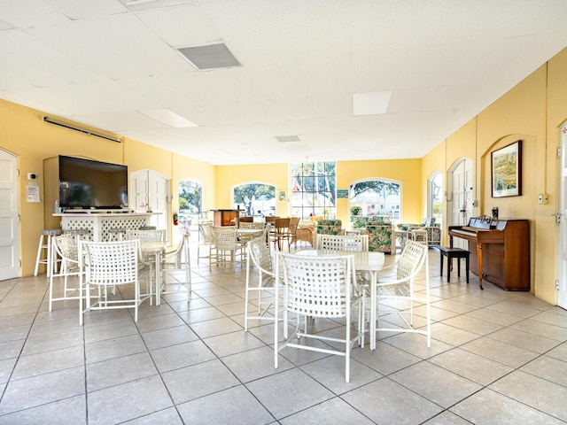 dining space featuring light tile patterned flooring