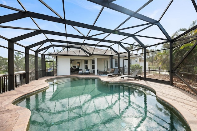 view of pool featuring a lanai and a patio area