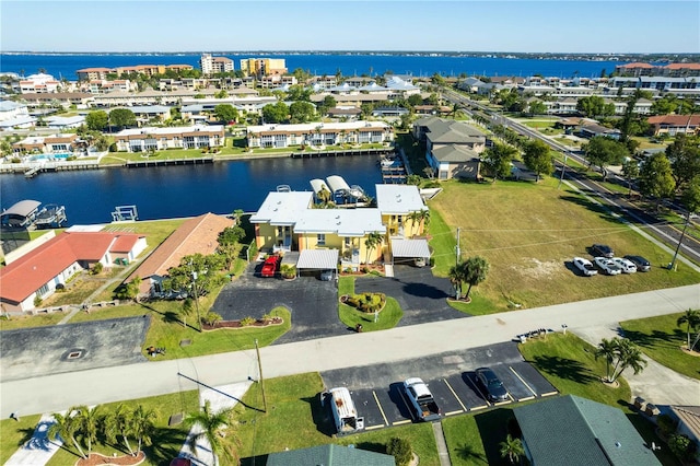 birds eye view of property featuring a water view