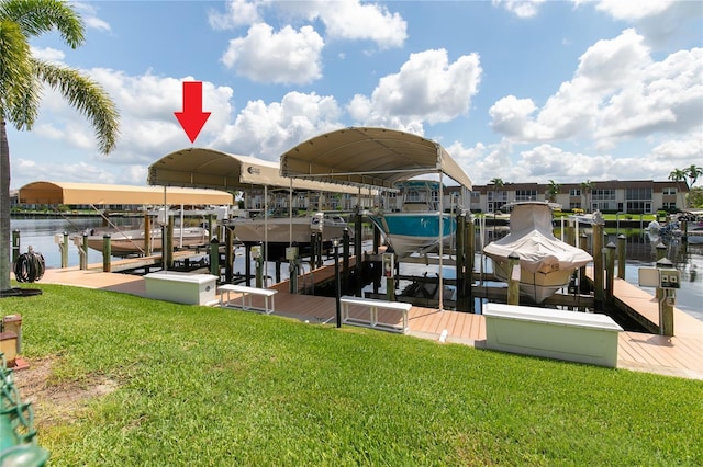 view of dock featuring a yard and a water view