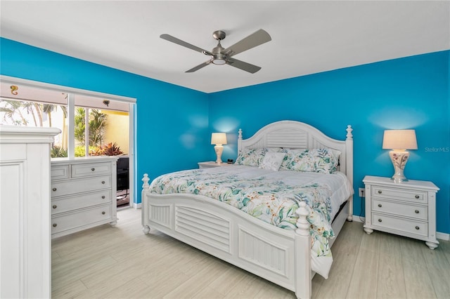 bedroom with light wood-type flooring and ceiling fan