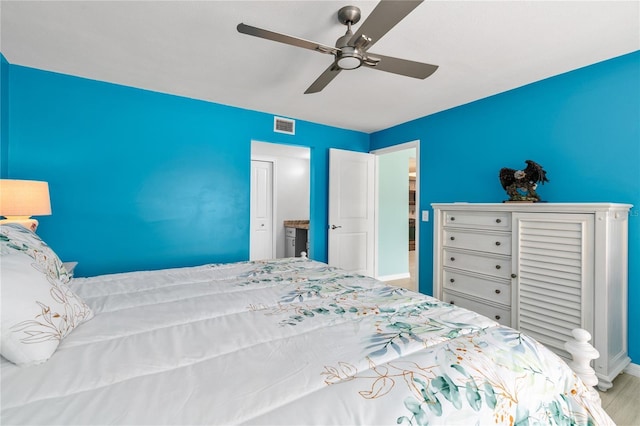 bedroom featuring ceiling fan and light hardwood / wood-style floors