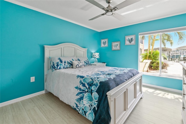 bedroom featuring ceiling fan, light hardwood / wood-style flooring, and ornamental molding