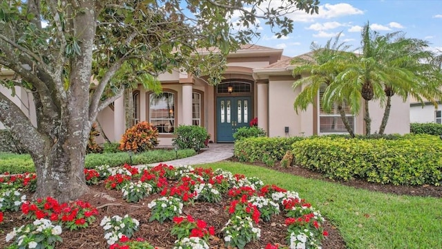 property entrance featuring french doors