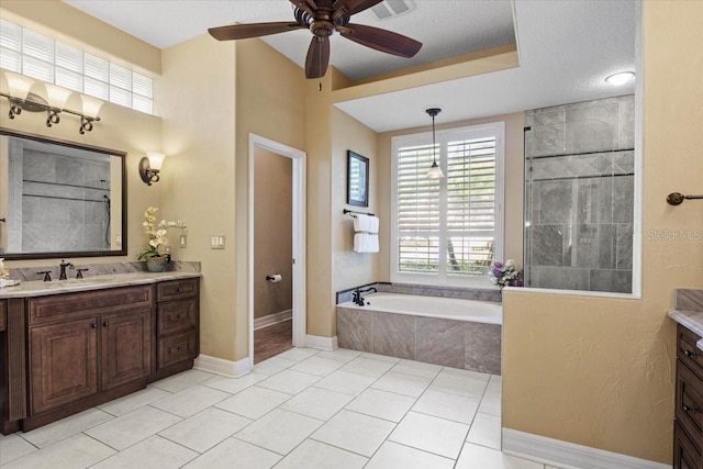 bathroom featuring tile patterned floors, vanity, ceiling fan, and separate shower and tub